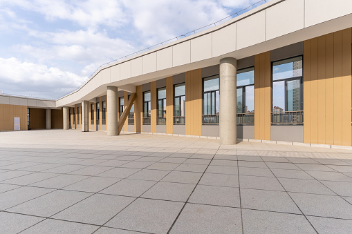 Empty slate passage and surrounding modern building