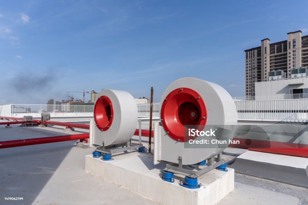 Ventilation equipment on the roof of modern buildings Air Duct Stock Photo