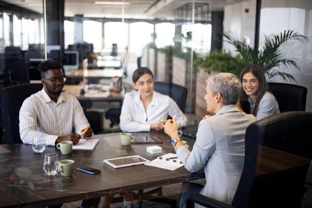 istock Competent business team brainstorming together in a conference room 1419063695