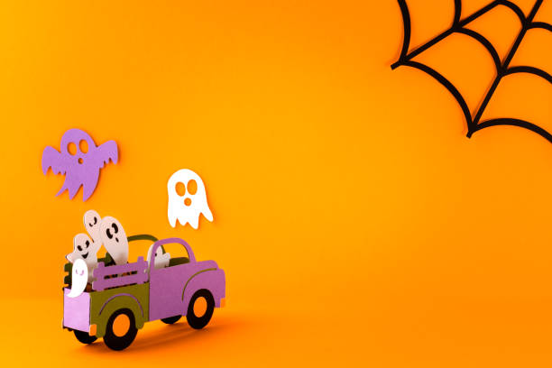 istock Happy halloween holiday concept. Halloween handmade paper decorations, spiders, spider web, ghosts in car on orange background. Halloween festival party, greeting card mockup with copy space 1419070851