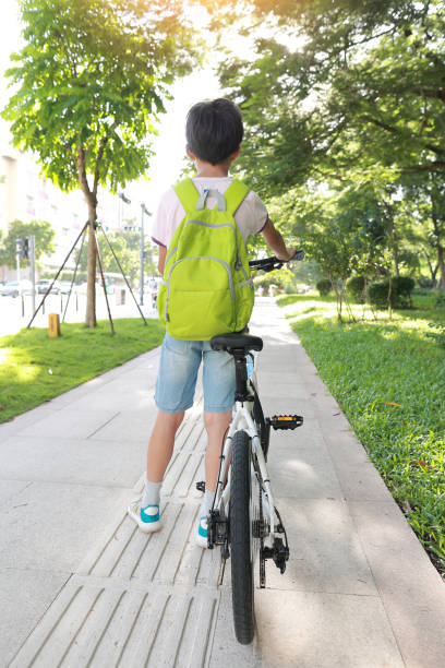 istock A little boy cycling in the park 1419071074