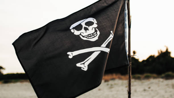 istock Pirates flag weaving on the beach 1419071784