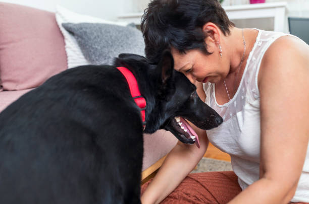 istock Woman cuddling with her dog 1419072816