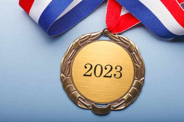 istock Blank Gold Medal  Engraved With 2023 On Blue Background 1419074288