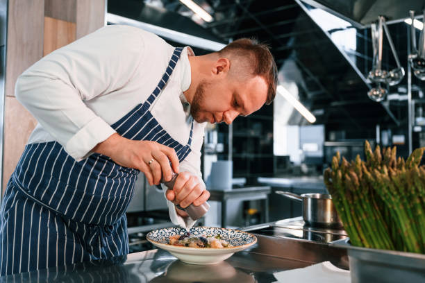 istock Making salad. Chef is on the kitchen preparing food 1419076611