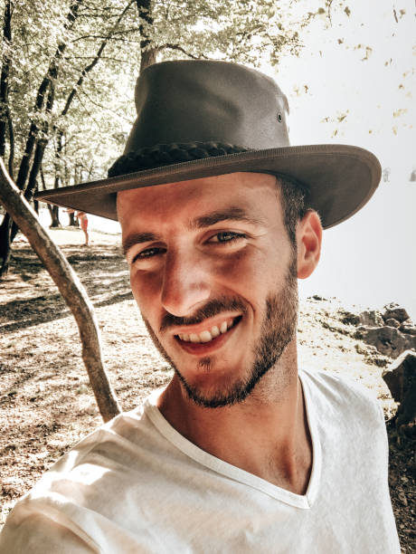 istock muscle man selfie with the hat 1419076696