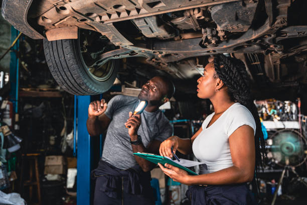 istock Two mechanic was checking the car suspension. 1419080270