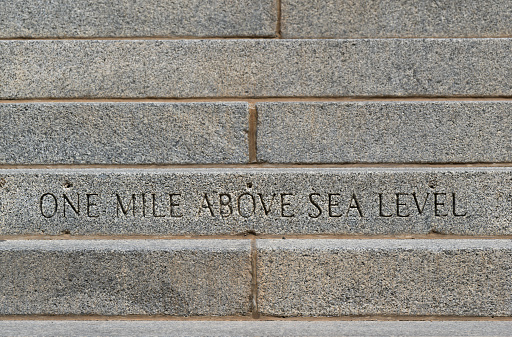 Denver, Colorado, USA - August 5, 2022: One Mile Above Sea Level etched into the exterior western stairs of the Colorado State Capitol building