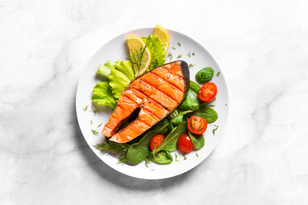 istock Grilled salmon steak with vegetable salad 1419081684