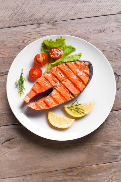 istock Grilled salmon steak with vegetable salad 1419081732
