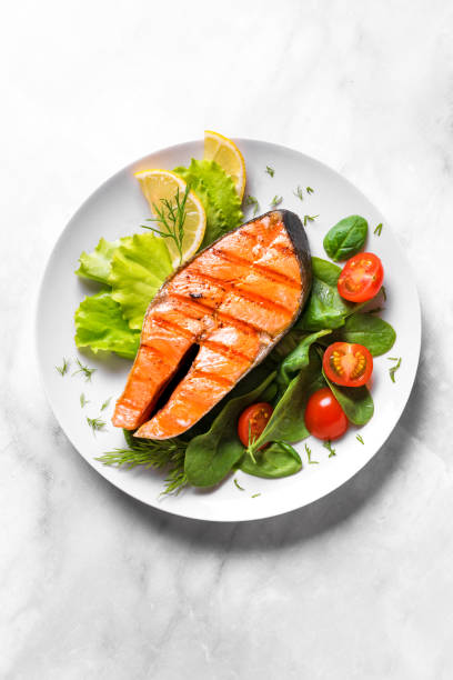 istock Grilled salmon steak with vegetable salad 1419081733