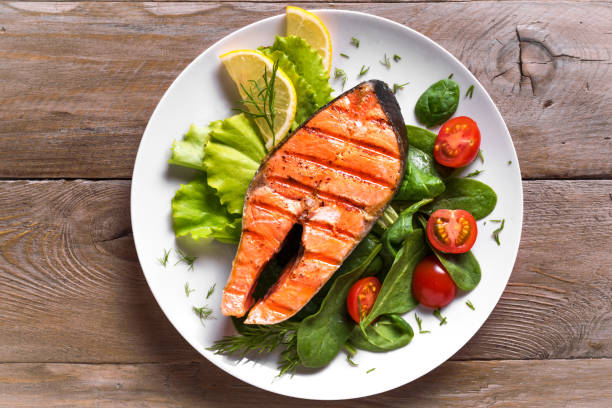 istock Grilled salmon steak with vegetable salad 1419081735