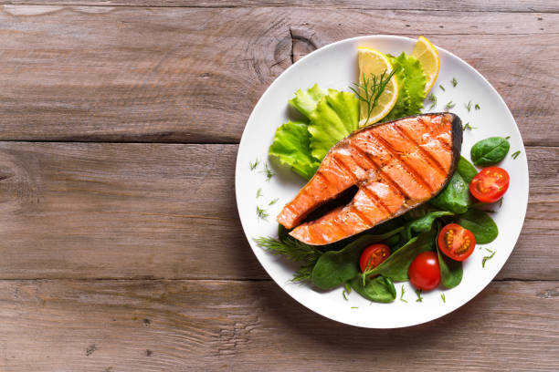 istock Grilled salmon steak with vegetable salad 1419081738