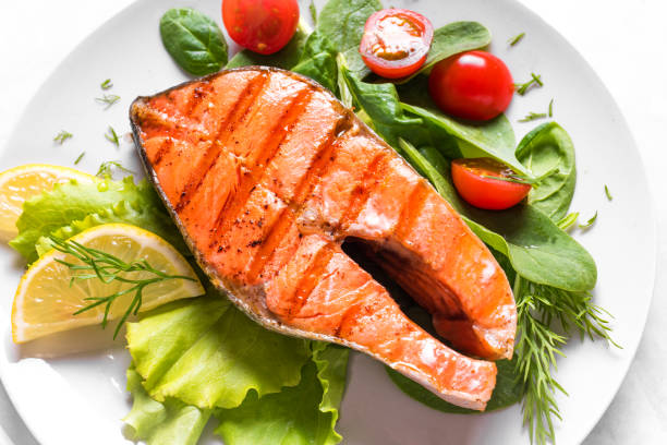 istock Grilled salmon steak with vegetable salad 1419081899