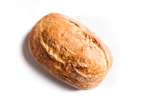 Fresh homebaked artisan sourdough bread. Loaf of bread isolated on white background, design element.