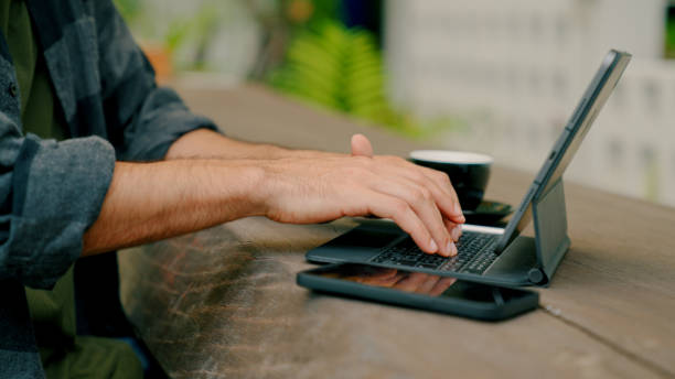 istock Young Asian Man Working Away from Office in a Cafe. 1419083319