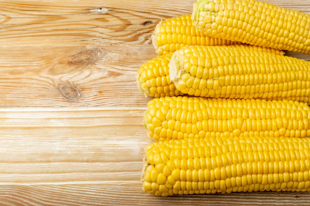 istock Sweet Corn Ears on Wooden Desk 1419084293