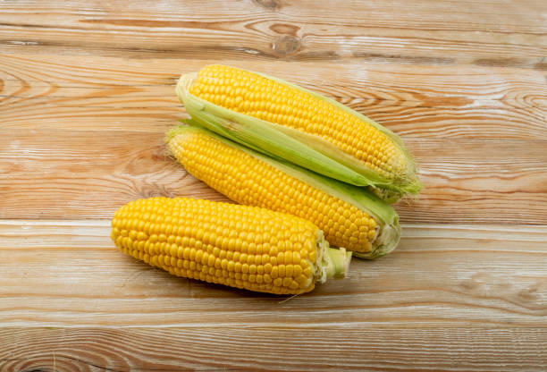 istock Sweet Corn Ears on Wooden Desk 1419084308