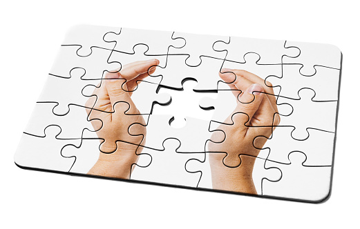 Jigsaw puzzle needs the final piece as a solution to a problem or challenge.