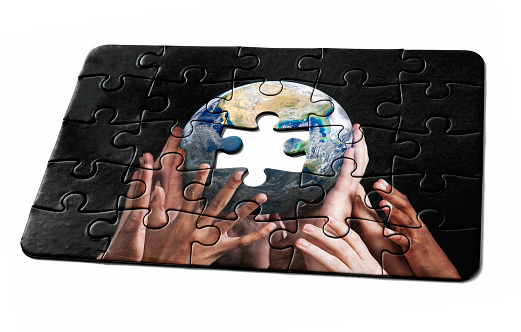 Jigsaw puzzle needs the final piece as a solution to a problem or challenge. Public-domain Earth image from https://www.nasa.gov/multimedia/imagegallery/image_feature_2159.html