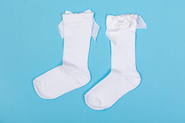 istock high white children's socks with big bows for festive clothes on a blue background 1419088850