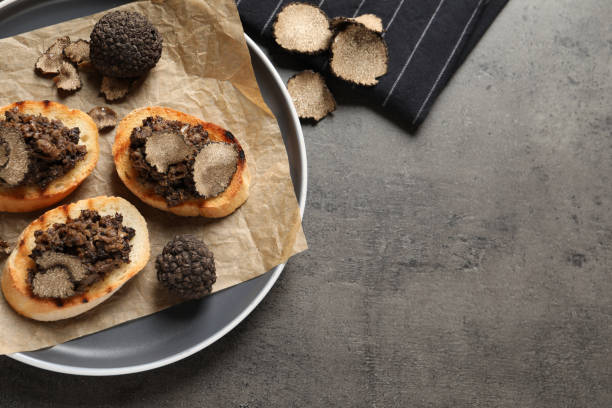 istock Delicious bruschettas with truffle sauce on grey table, flat lay. Space for text 1419088959