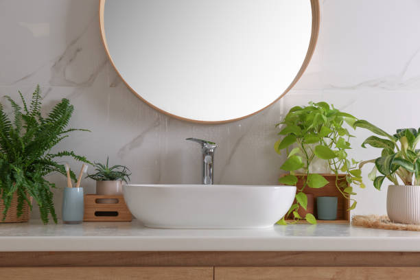 istock Bathroom interior with sink, beautiful green houseplants and mirror 1419089535