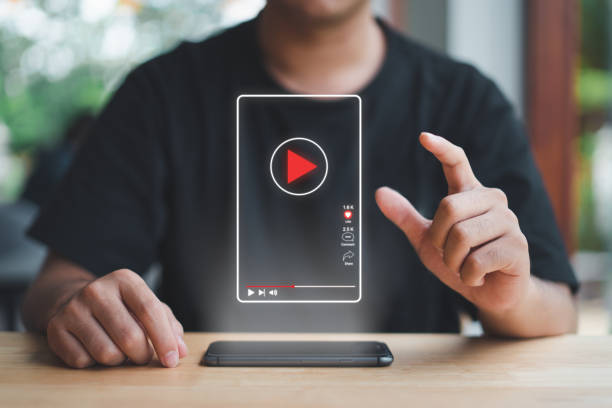 istock Man touch press button virtual short video online watch media screen with smart phone Using the Internet to connect to media, video, chat, doing business. 1419090194