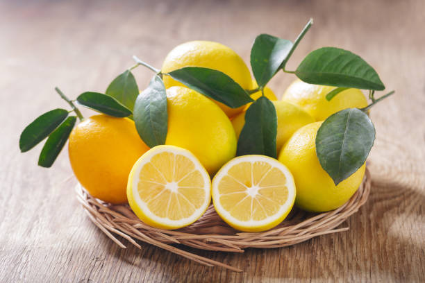 istock Fresh lemons on a wooden table 1419091066