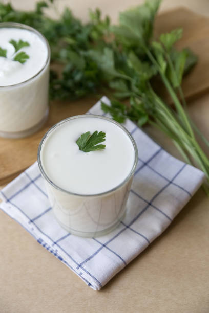 istock Ayran in a glass glass on a light brown background 1419092988