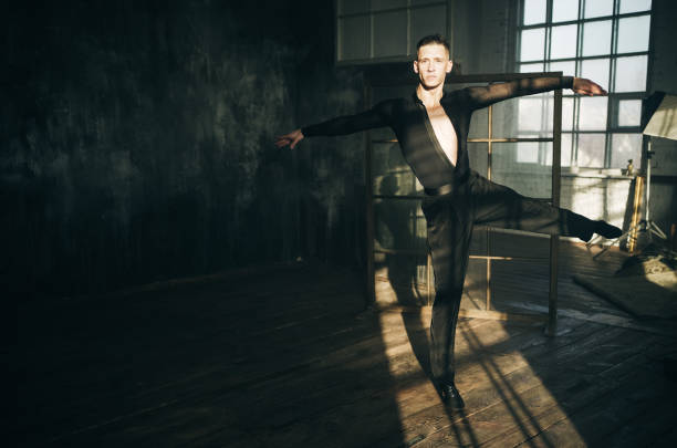 Professional ballroom dancer is dancing on loft studio. Beautiful art performance. Sport life concept.