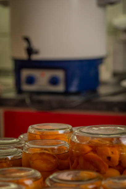 istock Making of apricot compote on wooden table interior summer 1419110765