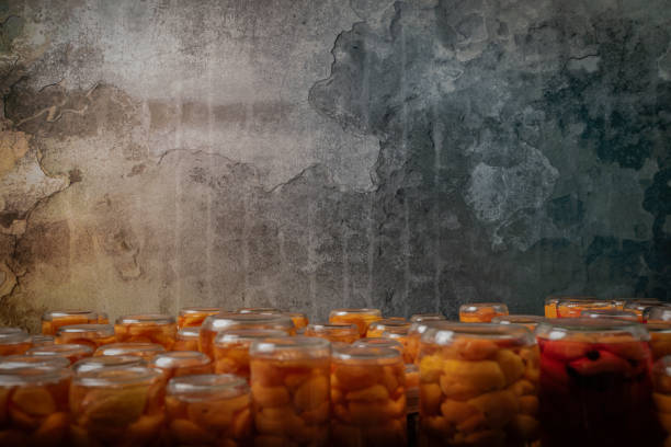 Making of apricot compote on wooden table interior middle of summer in cellar