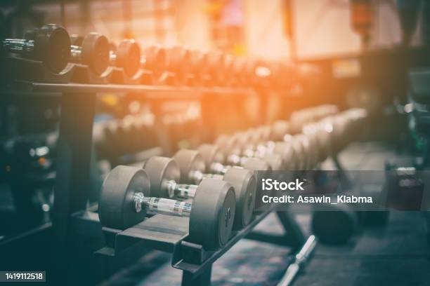 Gym And Dumbbell Weight Training Equipment On Sport Healthy Life And Gym Exercise Equipments And Sports Concept Copy Space Stock Photo - Download Image Now