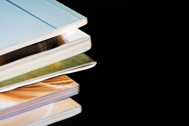 istock A part of a stack of magazines on dark background 1419112721