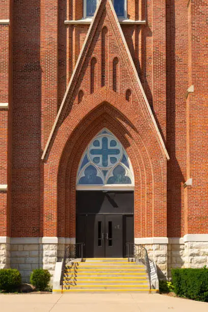 Entrance to old brick church in Midwest city.