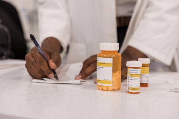 istock Unrecognizable male pharmacist confirms prescriptions 1419113236