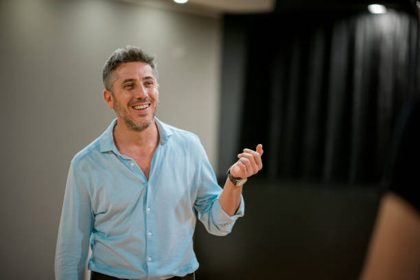 Man giving a speech in a gallery