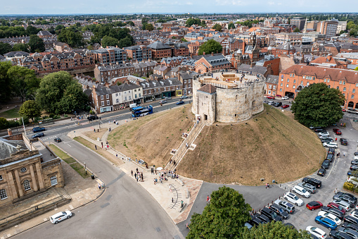 York, UK - August 28, 2022.  An aerial view of the historic and ancient architecture of Cliffords Tower in York.
