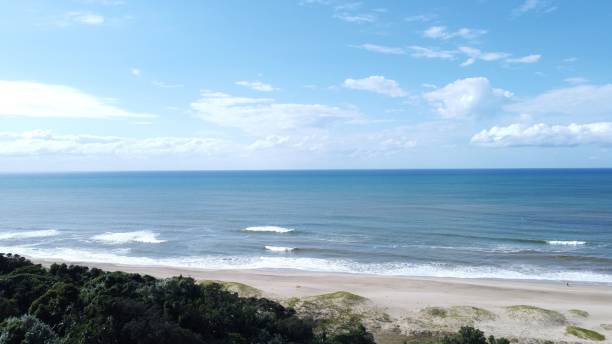 istock Aerial view of sea waves on a sandy beach 1419121565