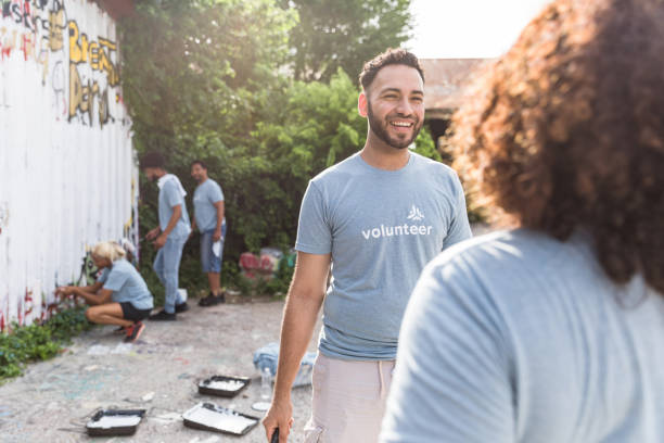 istock Friends take break from painting to talk 1419122348