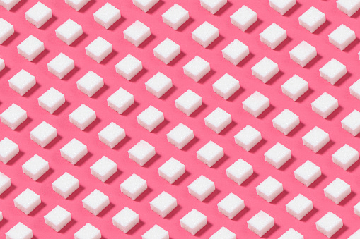 Sugar cubes pattern on pink background