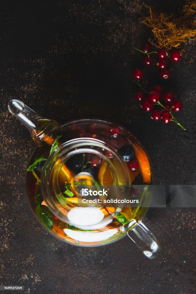 Herbal Tea Herbal tea and fresh fruits in the glass pot. Apple - Fruit Stock Photo