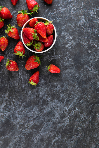 Fresh strawberries on dark background