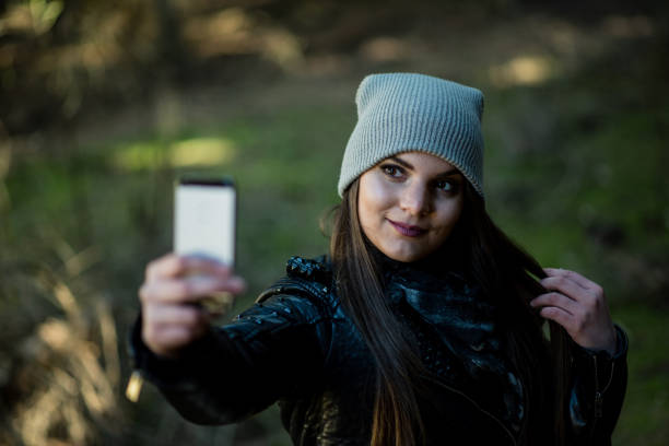 istock Woman taking selfie  in nature forest 1419127357