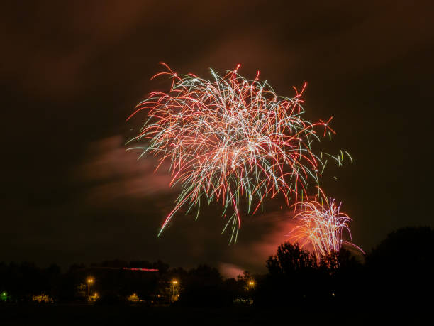 istock Colorful holiday fireworks and night sky background. 1419129257