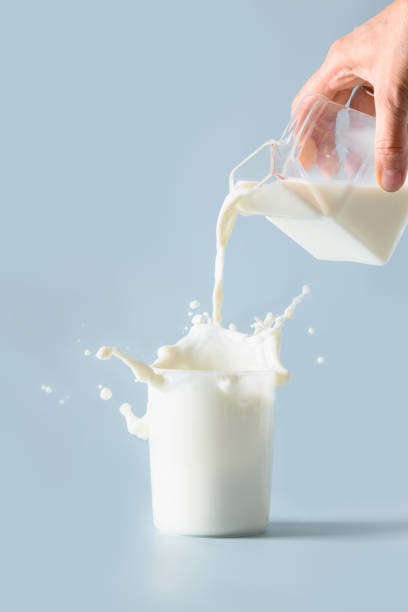 istock Splash of fresh organic milk in glass. Vertical format. 1419131121