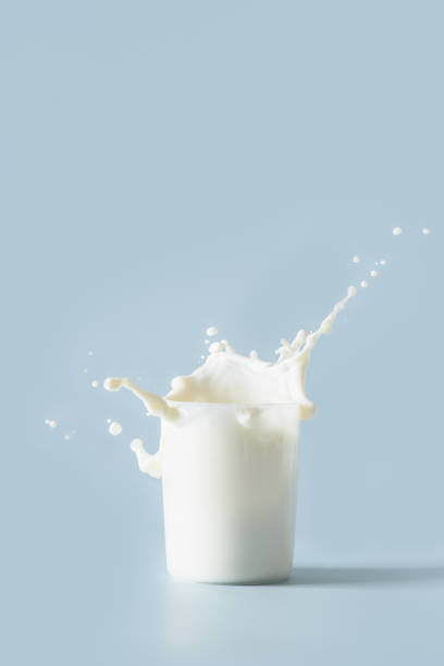 istock Splash of fresh organic milk in glass. Vertical format. 1419131518