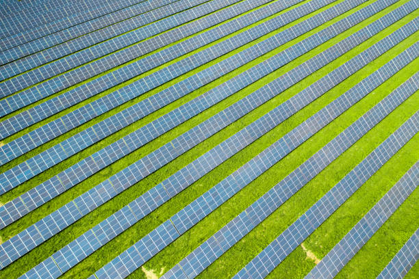 istock Rows of sun panels built on green field 1419136382