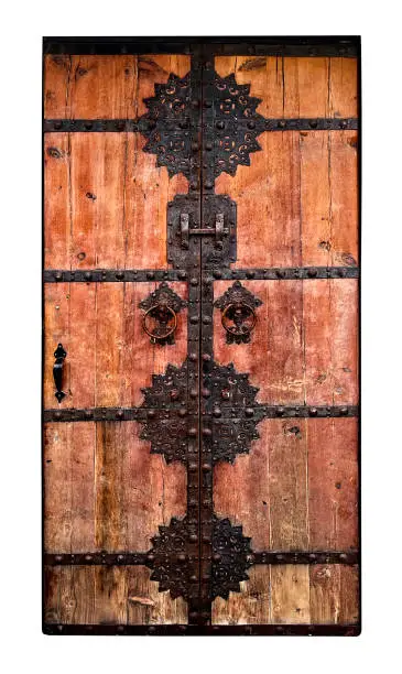 This is a photograph of an old antique door isolated on a white background.